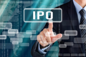 Businessman hand touching IPO (or Initial Public Offering ) sign on virtual screen