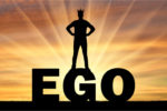 EGO: BlackRock CEO Goes Woke with Investor Money Silhouette of a man with a crown on his head standing on the word ego against the backdrop of a sunset. Concept of selfishness
