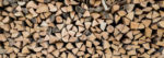 Your Survival Guy Stacking Wood and Compounding Money